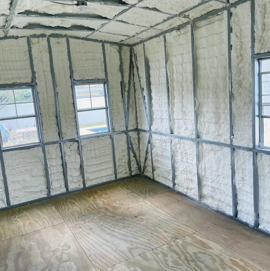 Closed-cell spray foam insulation applied to wall cavities in a residential project in Topeka